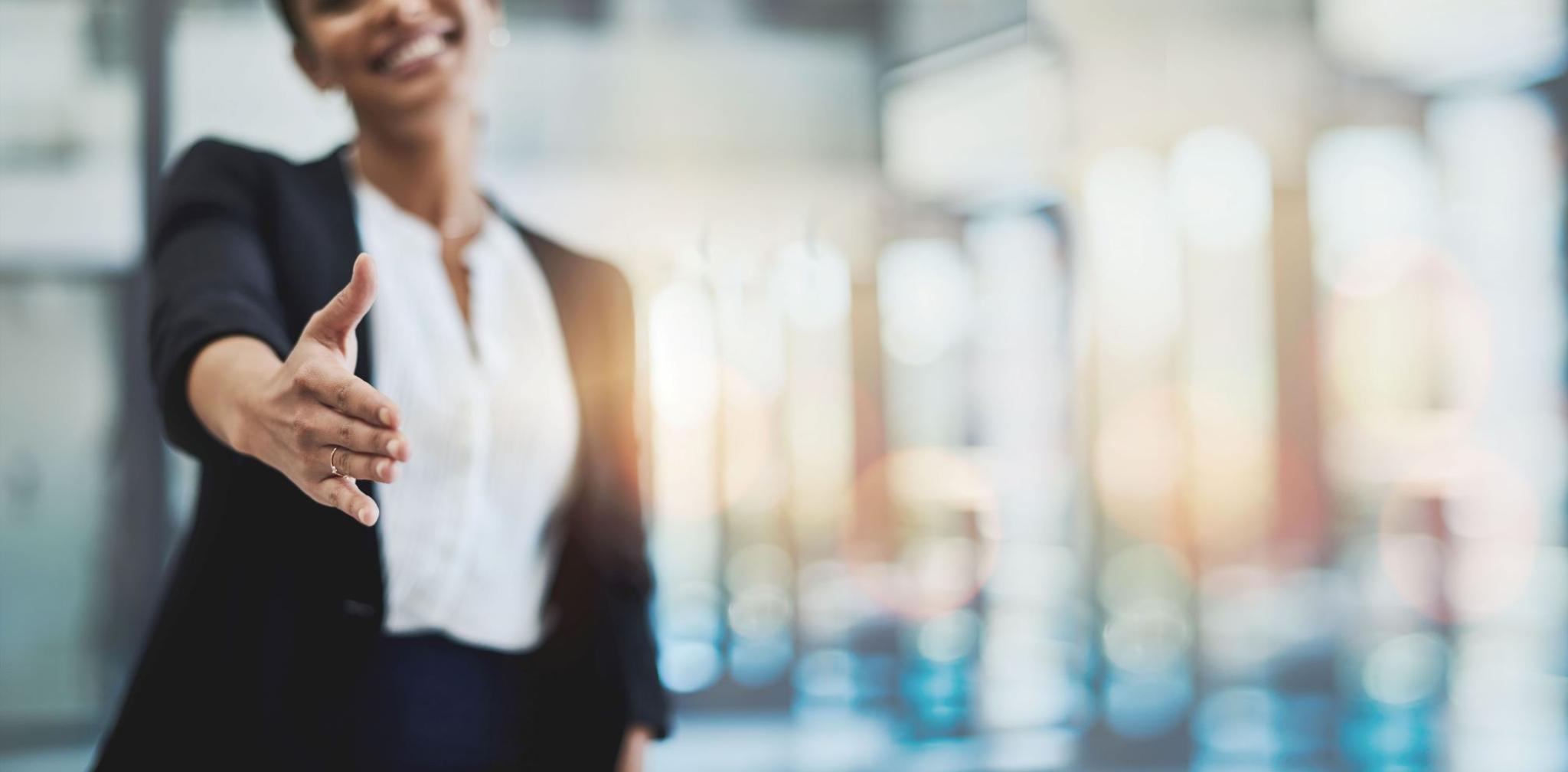 Image displaying a woman giving a handshake