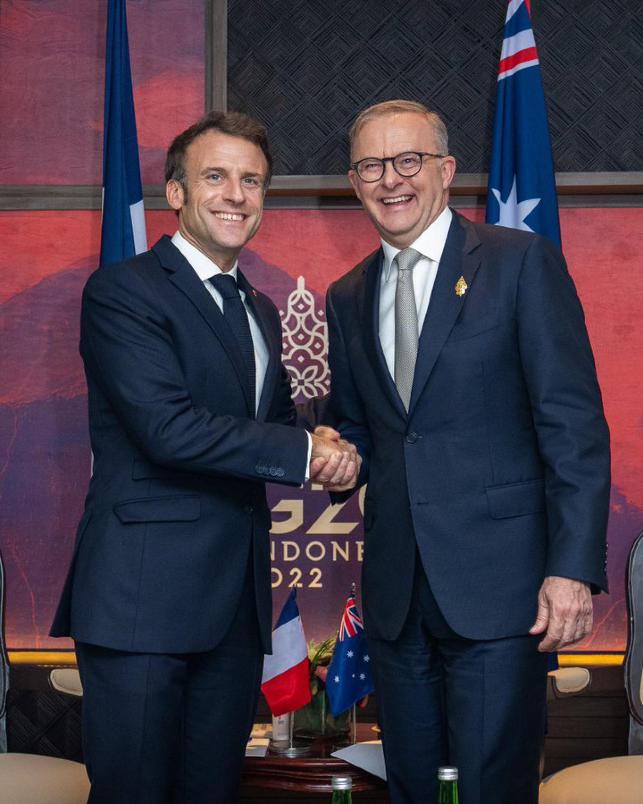 Australian Prime Minister Anthony Albanese and French President Emmanuel Macron shaking hands on the sidelines of G20