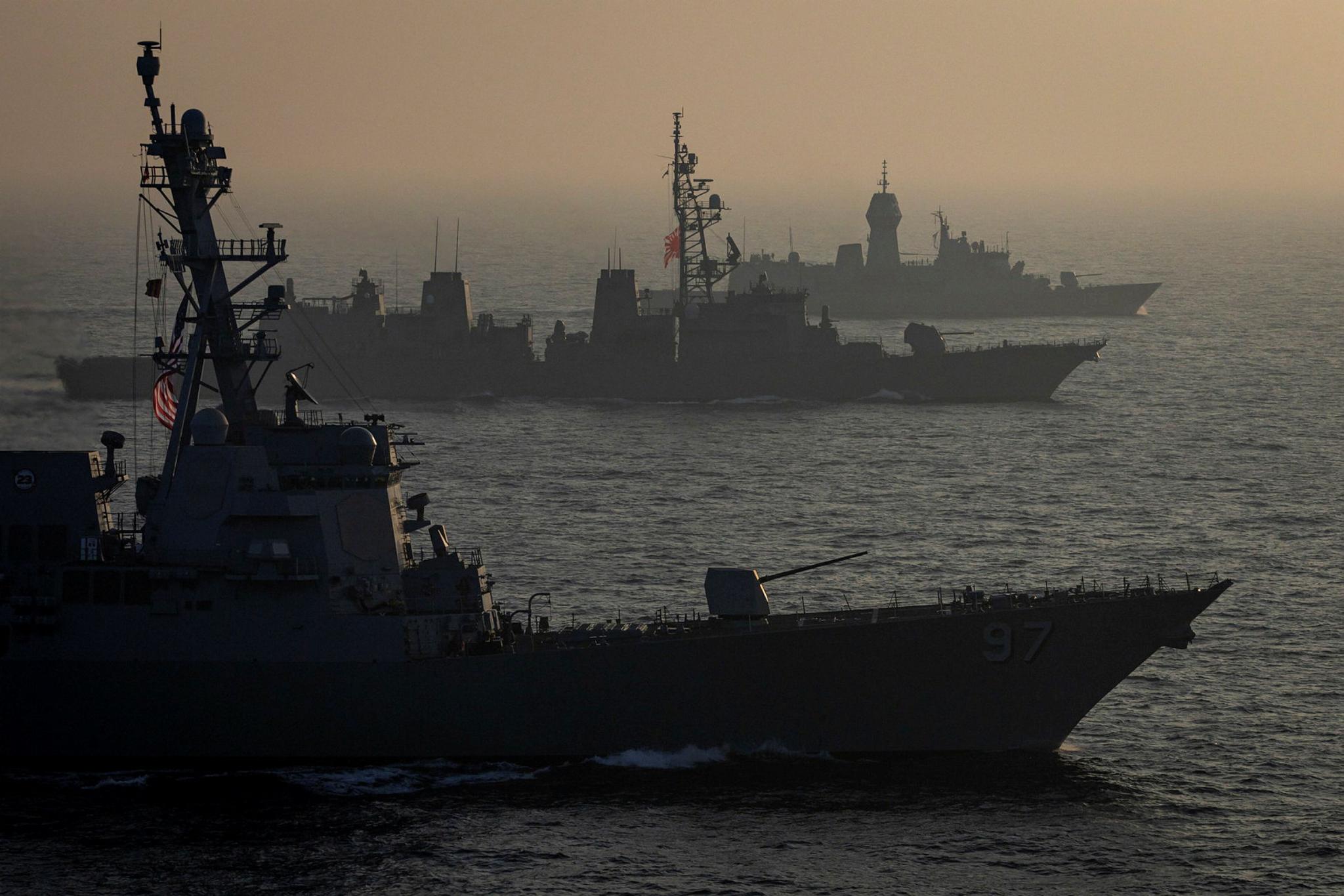 SS Halsey, JS Sazanami and HMAS Warramunga conduct a cooperative activity between Japan, the United States and Australia during a regional presence deployment.