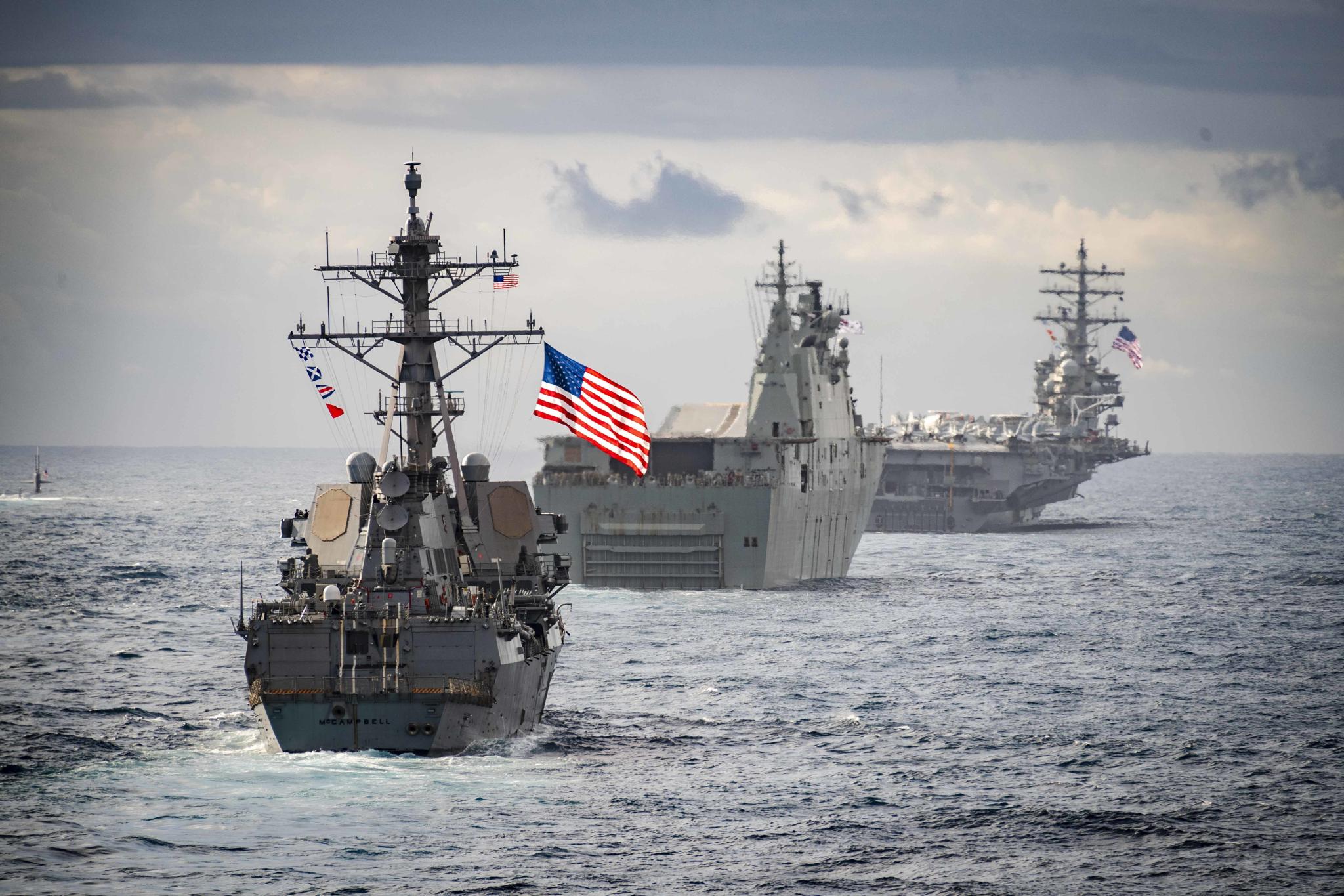 TASMAN SEA (July 11, 2019) The Arleigh Burke-class guided-missile destroyer USS McCampbell (DDG 85), the Royal Australian Navy Canberra-class landing helicopter dock HMAS Canberra (L02), center, the Los Angeles-class attack submarine USS Key West (SSN 722), far left, and the Nimitz-class aircraft carrier USS Ronald Reagan (CVN 76) are underway in formation during Talisman Sabre 2019. Ashland, part of the Wasp Amphibious Ready Group, with embarked 31st Marine Expeditionary Unit, is currently participating in