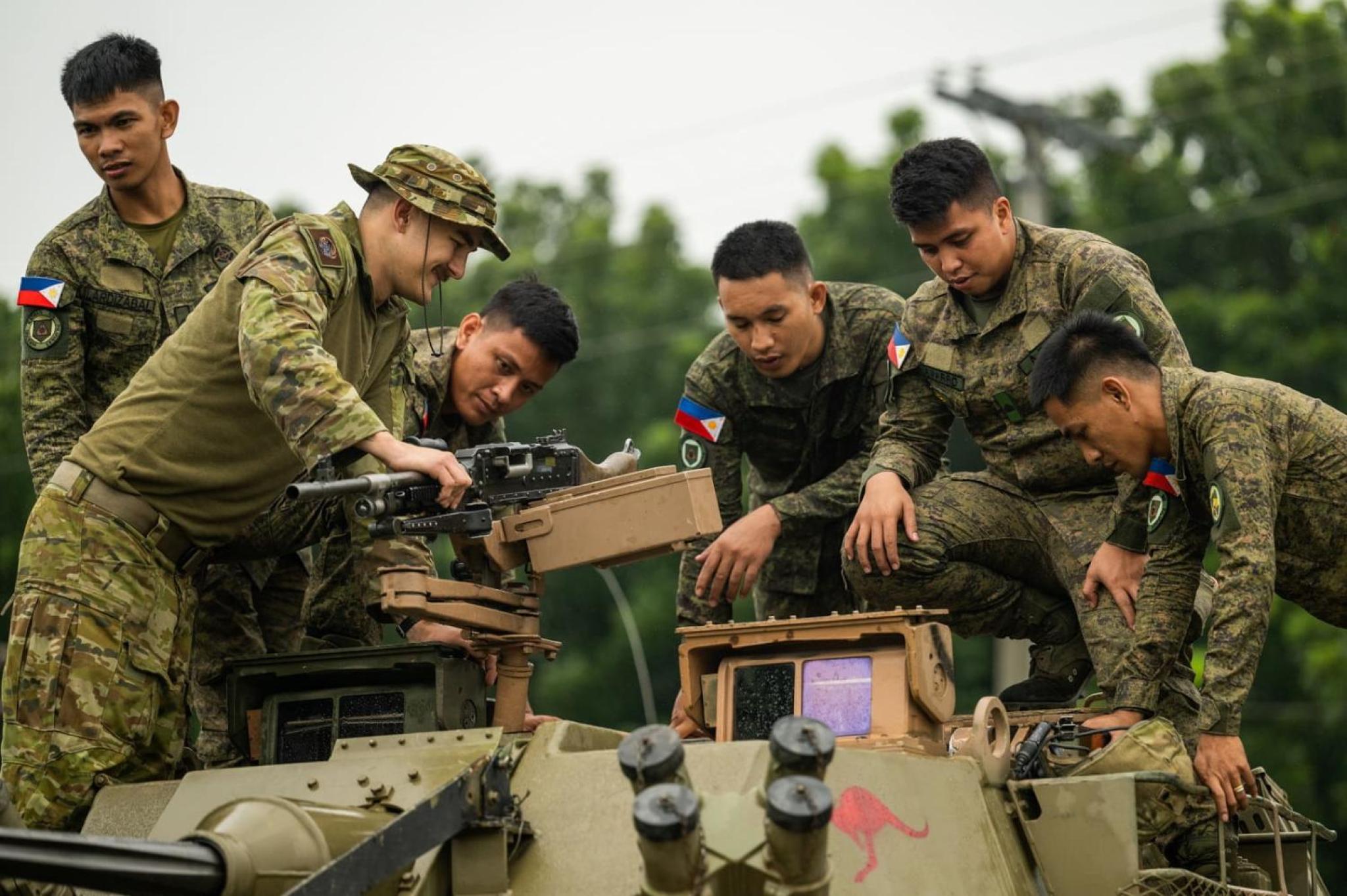 Soldiers from the Australian Army and the Armed Forces of the Philippines provide tours of their respective armoured vehicles during Exercise ALON 25 (SGT Roger Tang/Defence Images)