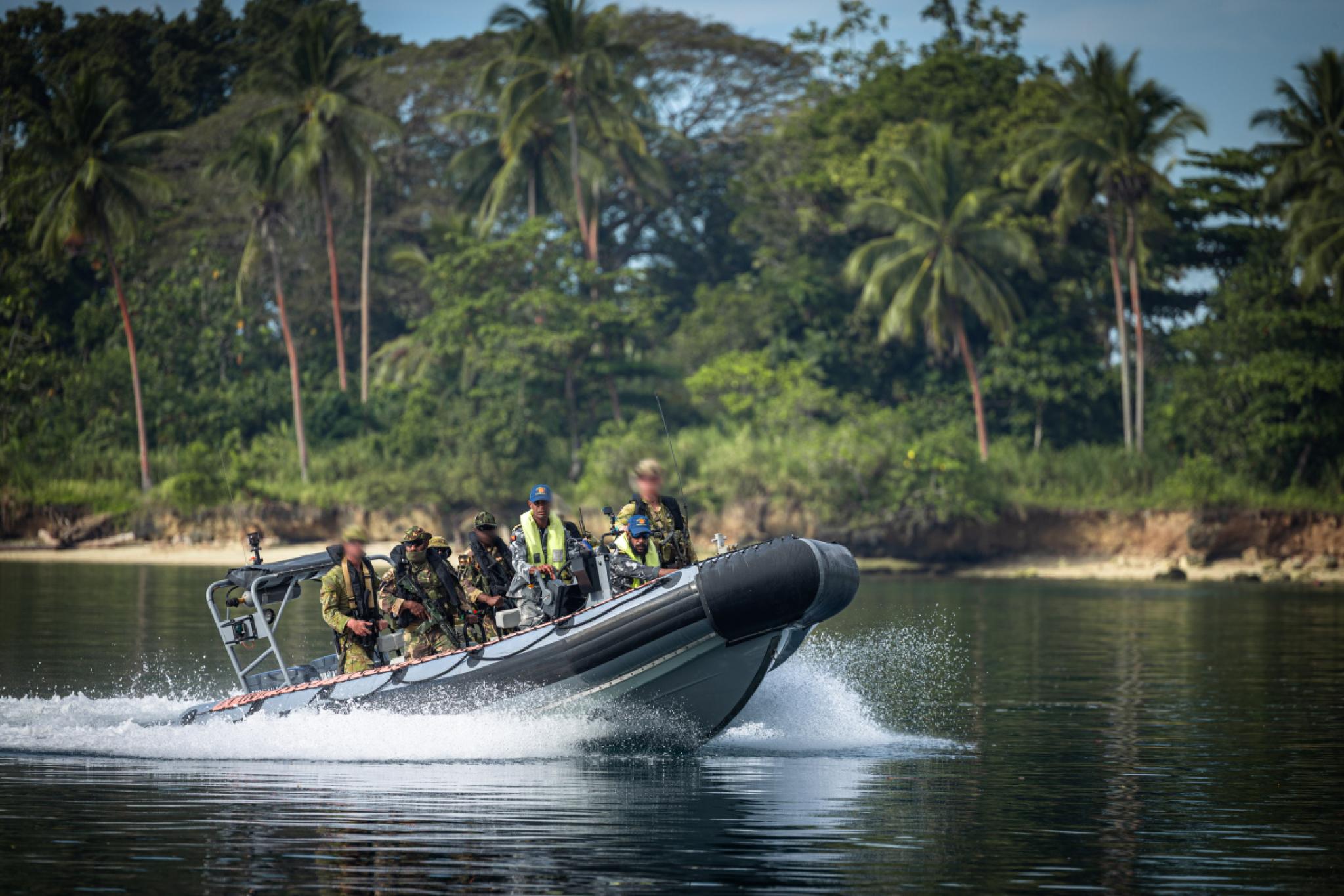 Australian Army soldiers and Papua New Guinea Defence Force soldiers are brought ashore by Papua New Guinea Defence Force coxswains during Exercise Talisman Sabre 2025 in Papua New Guinea.