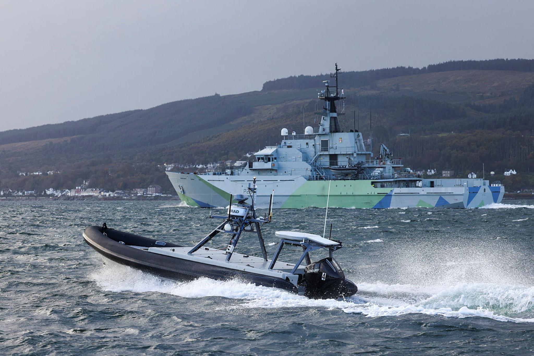The Rattler, foreground, Unmanned Surface Vehicle escorts HMS Tyne off the coast of Scotland