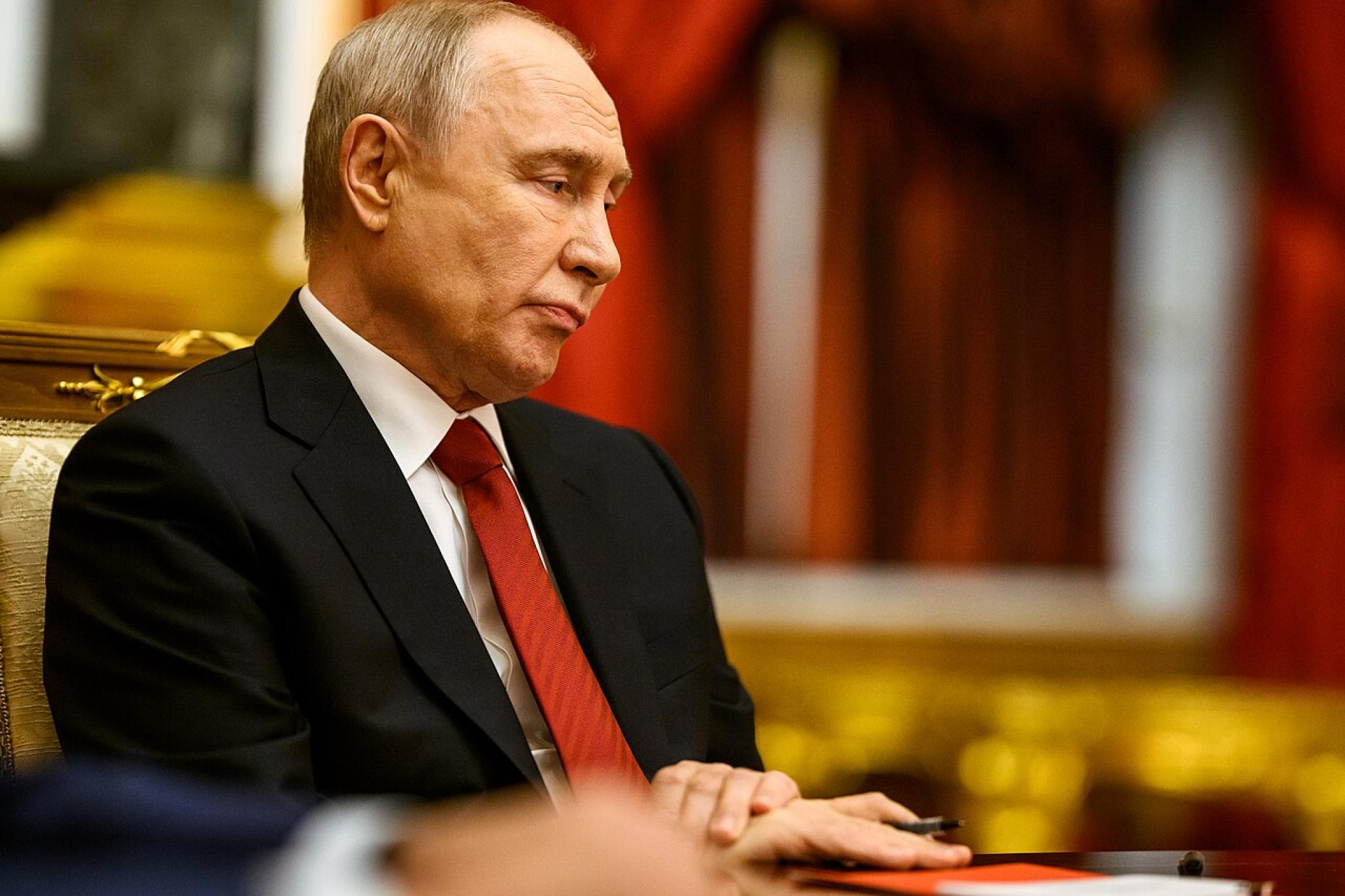 Russian President Vladimir Putin in the Red Drawing Room at the Kremlin in Moscow
