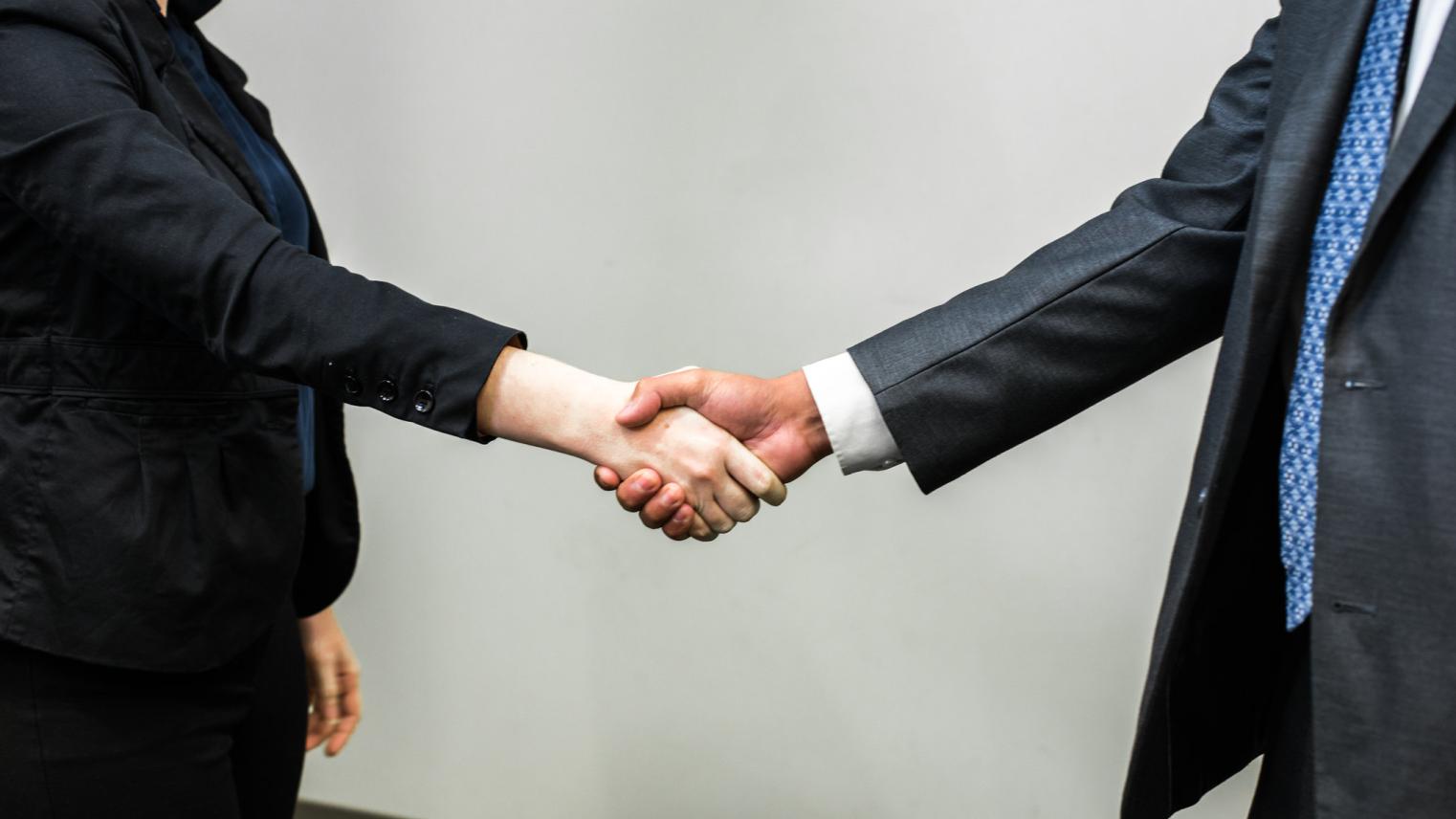  Two officials shaking hands