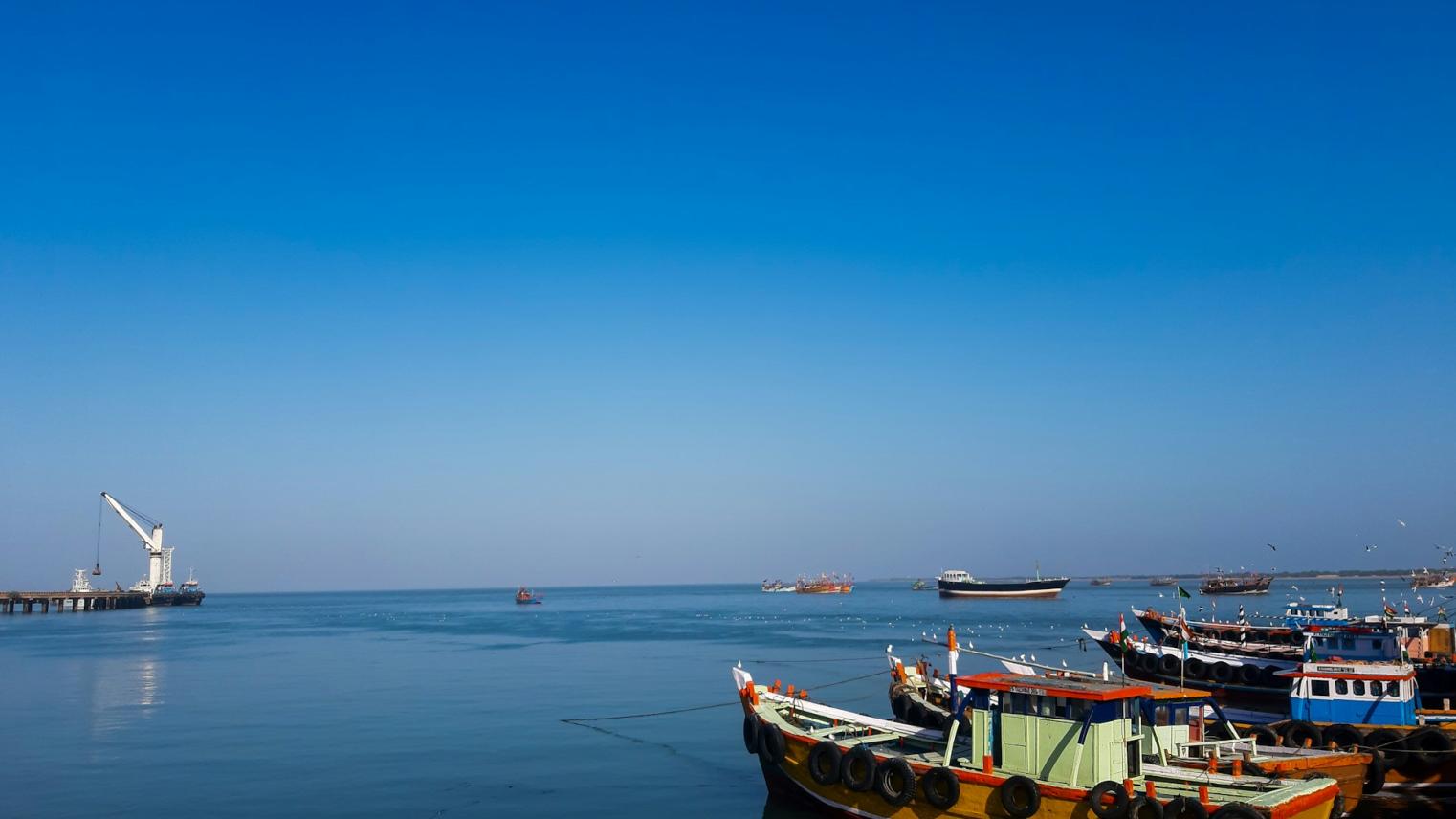 Image of boats in a dock in Gujarat, India