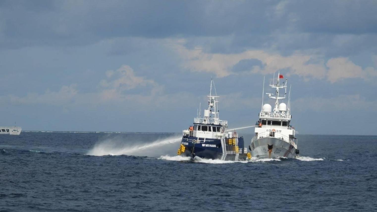 CCG vessel with bow number 21559 firing its water cannon directly at the BRP Datu Pagbuaya